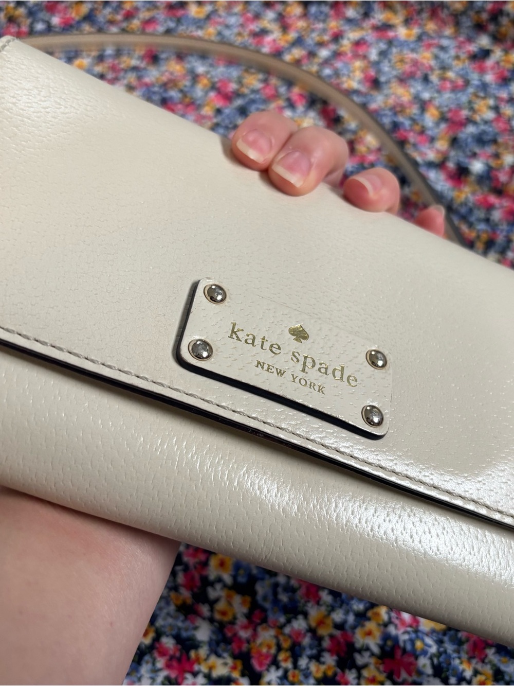 kate spade cream leather clutch with gold logo plaque